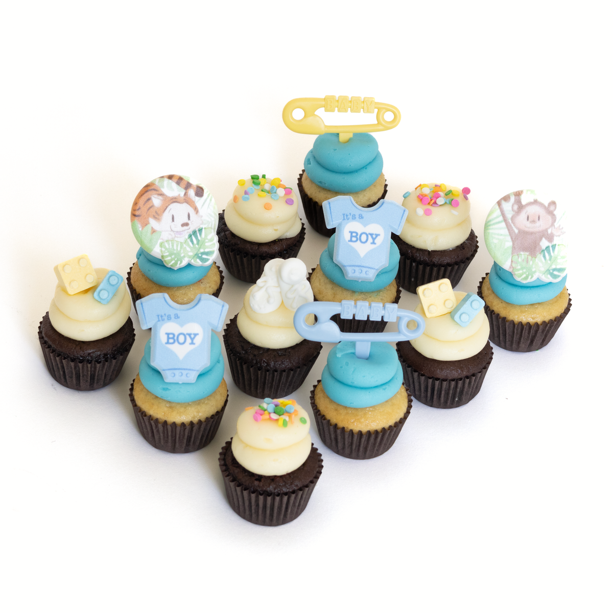 The It's a Boy Dozen 12 pack of nut-free cupcakes with blue and white frosting and baby animal rings for a baby shower in Toronto.