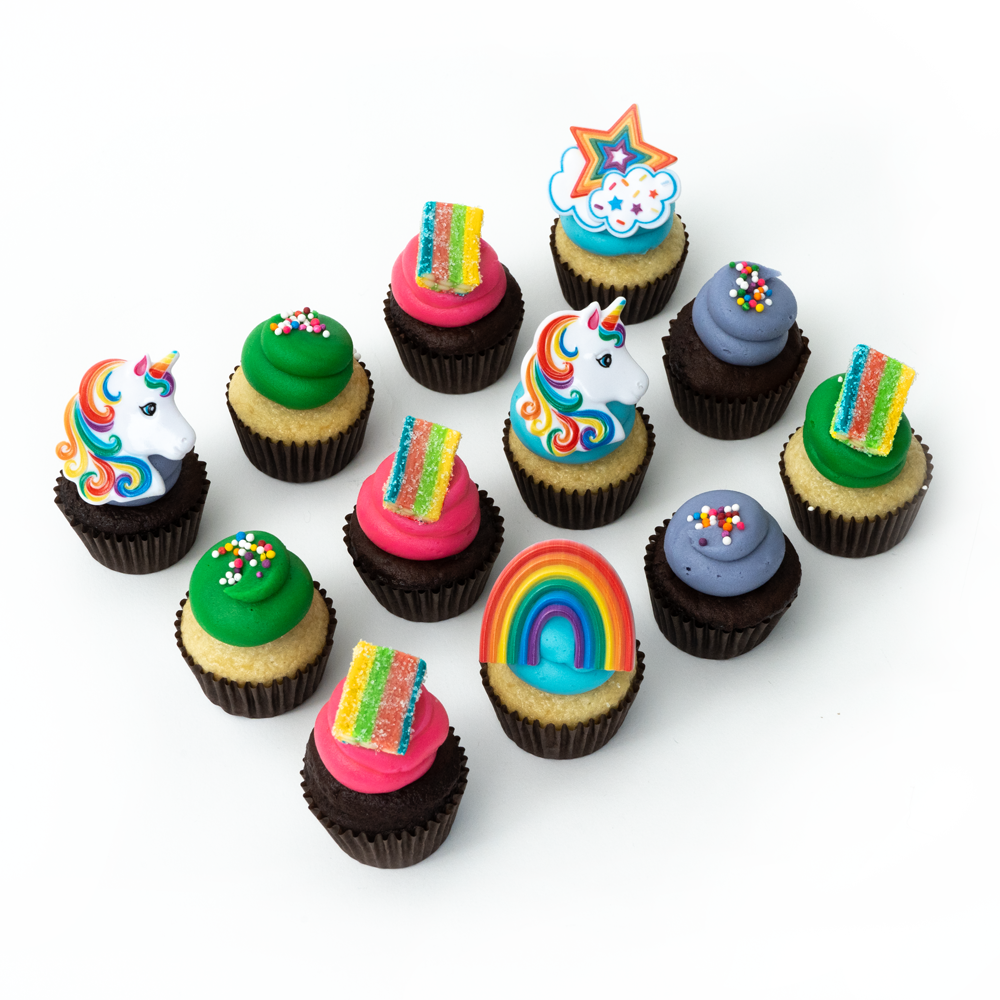 The Happy Rainbow Sparkle Unicorn Dozen 12 pack of nut-free cupcakes with unicorn horns and rainbow frosting for Toronto delivery.