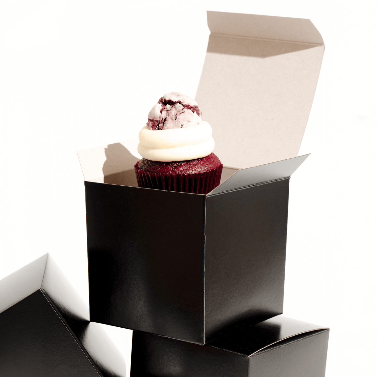 Single nut-free cupcake in a matte black gift box, freshly baked in Toronto and ready to give.