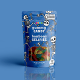 A bag of dual-toned gummy worms in a blue dancing skeletons Halloween pouch, certified 100% peanut and tree nut free.