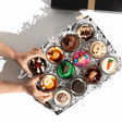 An assortment of 12 Dirty Dozen Jarcakes in clear glass jars featuring gourmet nut-free cupcake flavours like Red Velvet and Oreo for party catering in Toronto.