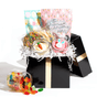 The Easter Essentials gift box overflowing with assorted nut-free cookies and bright spring candies for delivery in Toronto.