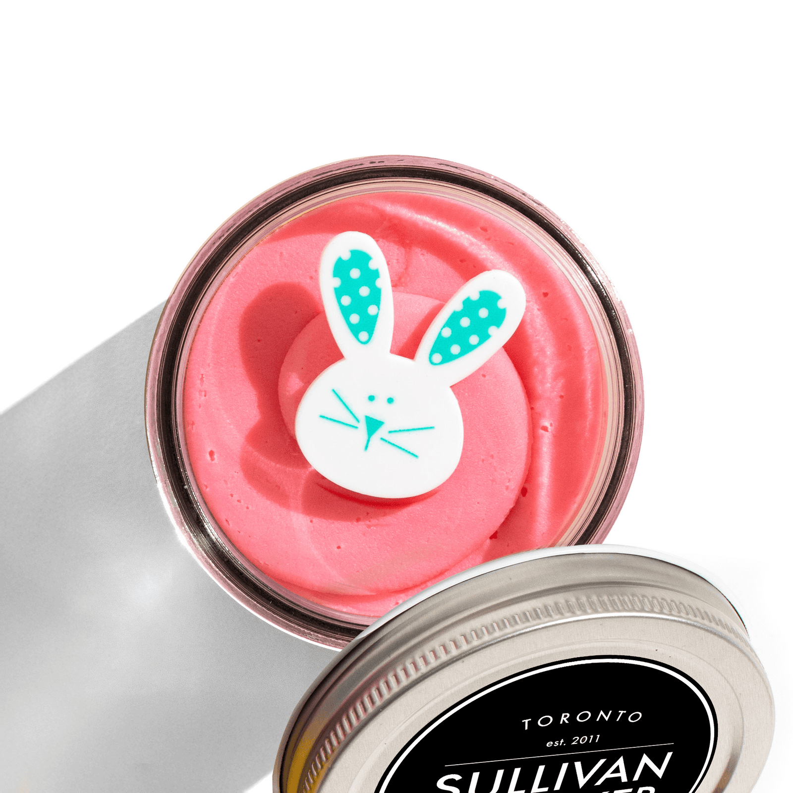 The Eggstra Special Easter Jarcake with pink and green frosting in a glass jar, nut-free Easter treat baked fresh in Toronto.