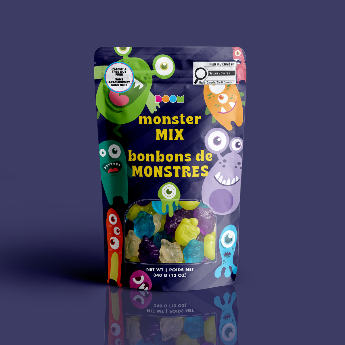 A bag of colourful monster-shaped gummies in a navy pouch with silly cartoon monsters, certified 100% peanut and tree nut free.