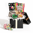 The Holiday Essentials Box, a festive gift set containing Jarcakes, cookies, and Christmas-themed Boom Candy assortment, for delivery in Toronto.