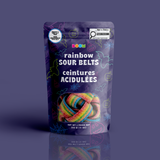 A bag of colourful rainbow sour belts in a purple neon bats and pumpkins Halloween pouch, certified 100% peanut and tree nut free.