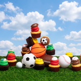 A dozen sports-themed nut-free cupcakes featuring vanilla and chocolate bases with red, green, yellow, and chocolate frosting, topped with sports balls and gummy rings.