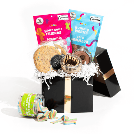 The Sweet Essentials Box, a gourmet gift set containing Jarcakes, individually wrapped cookies, and Boom Candy assortment, for delivery in Toronto.