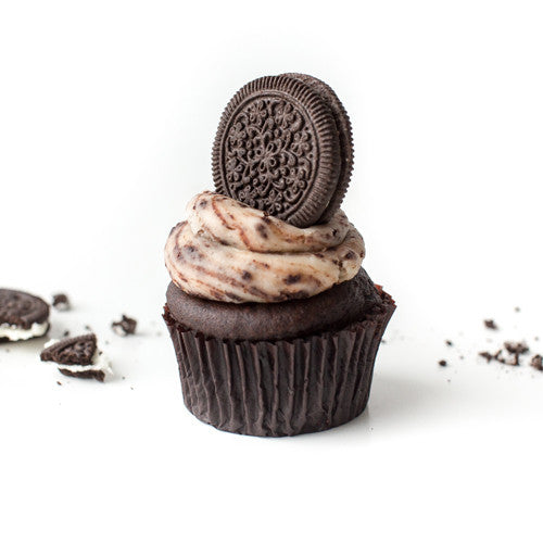 Single Cookies & Cream gourmet nut-free cupcake with cream frosting, crushed cookies, and a whole chocolate cookie on top for Toronto delivery.