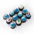 The Let It Snow Dozen 12 pack of nut-free cupcakes with blue and vanilla frosting and snowflake sprinkles for winter party delivery in Toronto.	