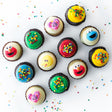 The Sunny Days Dozen 12 pack of licensed nut-free Sesame Street cupcakes with Elmo and Big Bird for birthday party Toronto delivery.