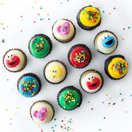 The Sunny Days Dozen 12 pack of licensed nut-free Sesame Street cupcakes with Elmo and Big Bird for birthday party Toronto delivery.
