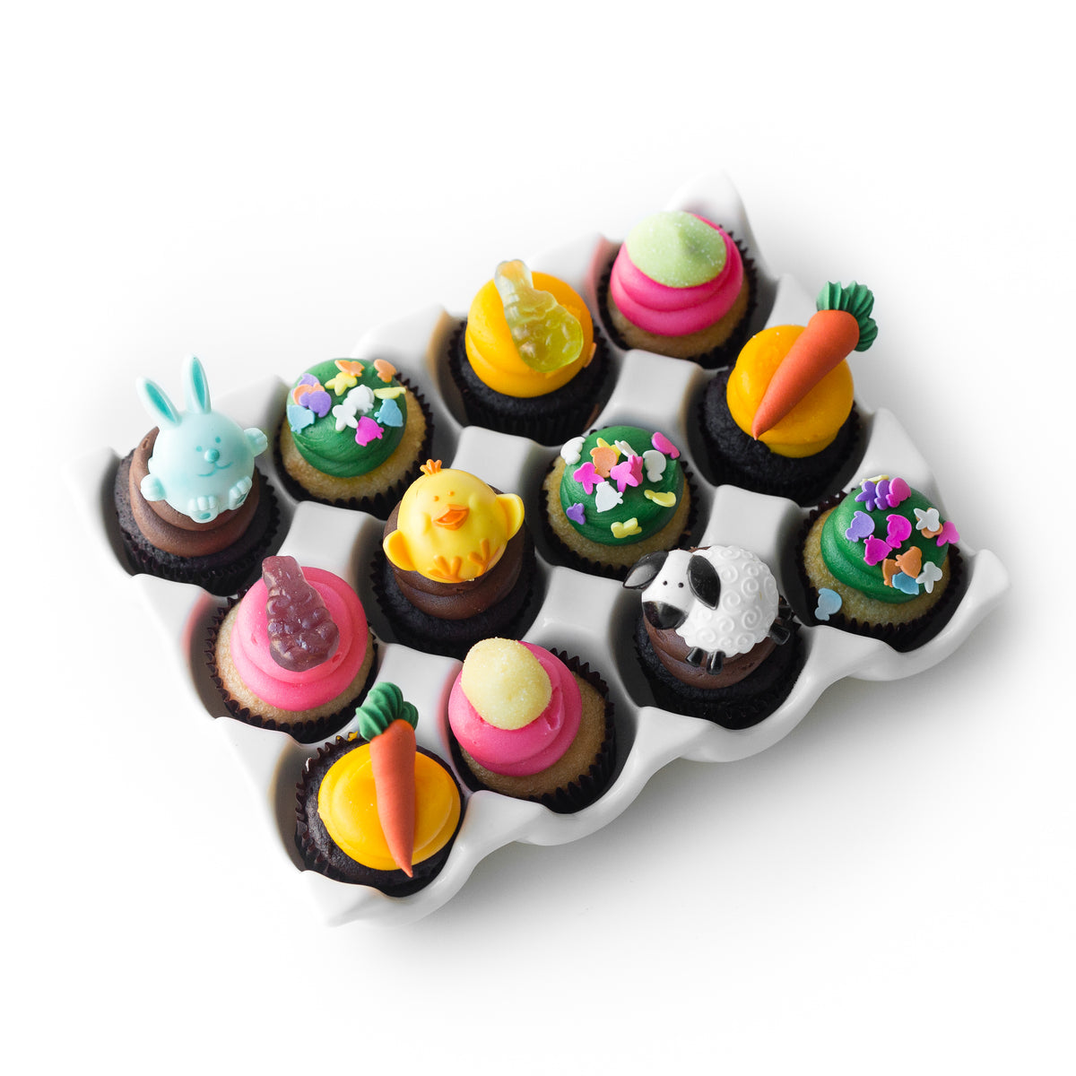 The Eggstra Special Easter Dozen 12 pack of nut-free cupcakes with pastel frosting and Easter bunny rings for Toronto delivery.	