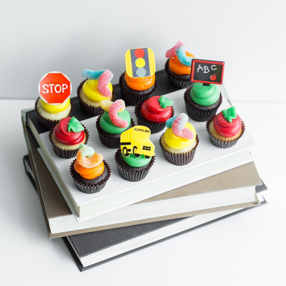 The School House Dozen nut-free chocolate and vanilla cupcakes with back to school candy decorations and rings for Toronto delivery