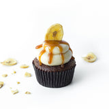Single Banana Caramel Maple gourmet nut-free cupcake with maple frosting and a banana chip garnish for Toronto delivery.