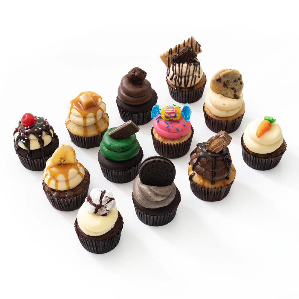 The Dirty Dozen 12 assorted gourmet nut-free cupcakes full size and mini for Toronto delivery.	