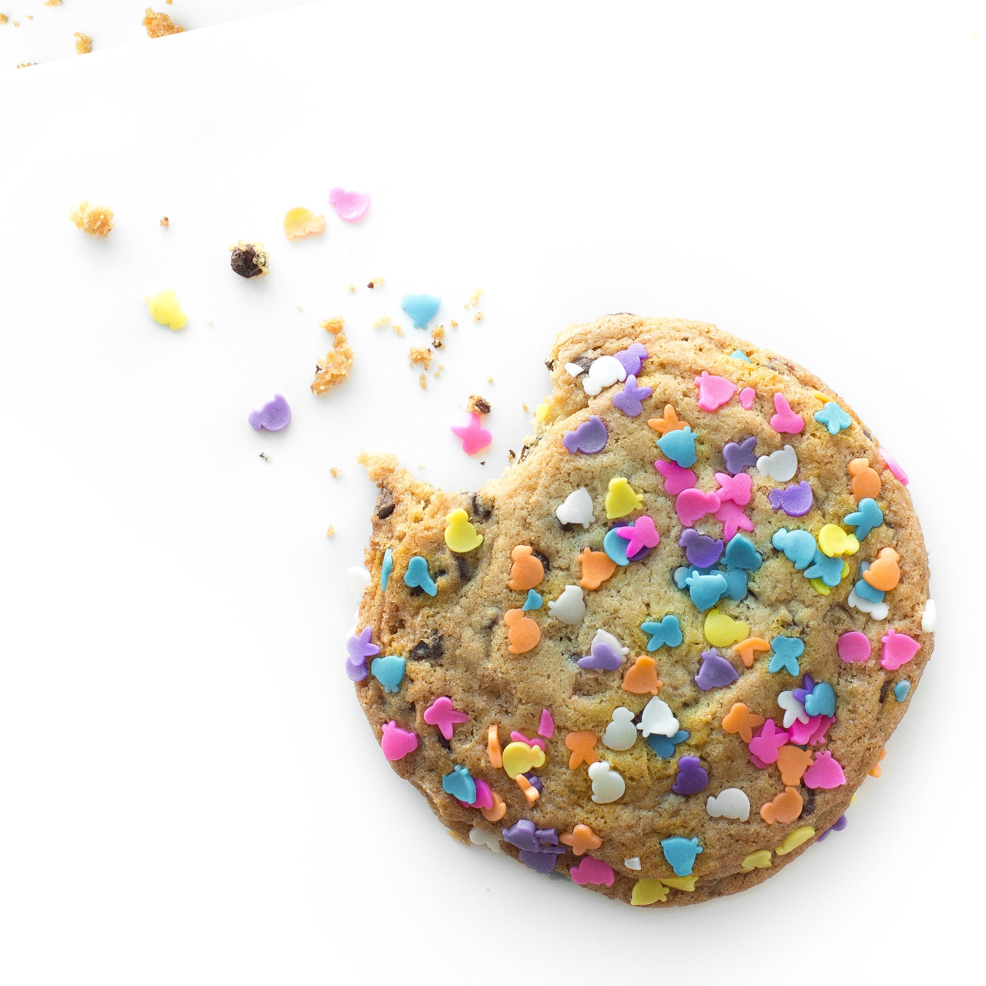 Single soft-baked Easter nut-free cookie, individually wrapped, topped with pastel spring sprinkles for an Easter basket filler in Toronto.