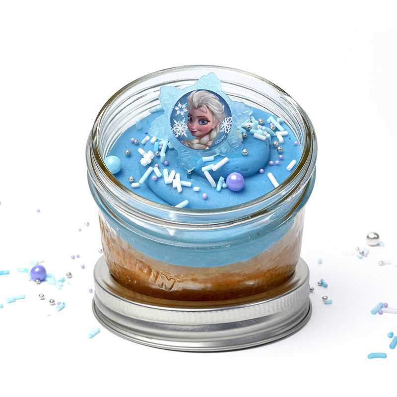 Frozen Jarcake (Mini/Regular sizes) in a jar with personalized sticker option, blue frosting, and Elsa/Anna ring for nut-free delivery in Toronto.