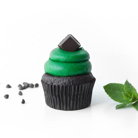 Single Mint Chocolate Chip gourmet nut-free cupcake with green mint frosting and chocolate pieces on top for Toronto delivery.