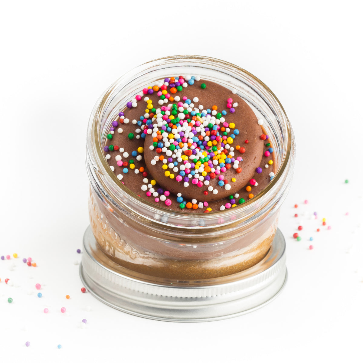 Old Fashioned Jarcake (Mini/Regular sizes) in a jar with personalized sticker option, chocolate frosting, and sprinkles for nut-free delivery in Toronto.