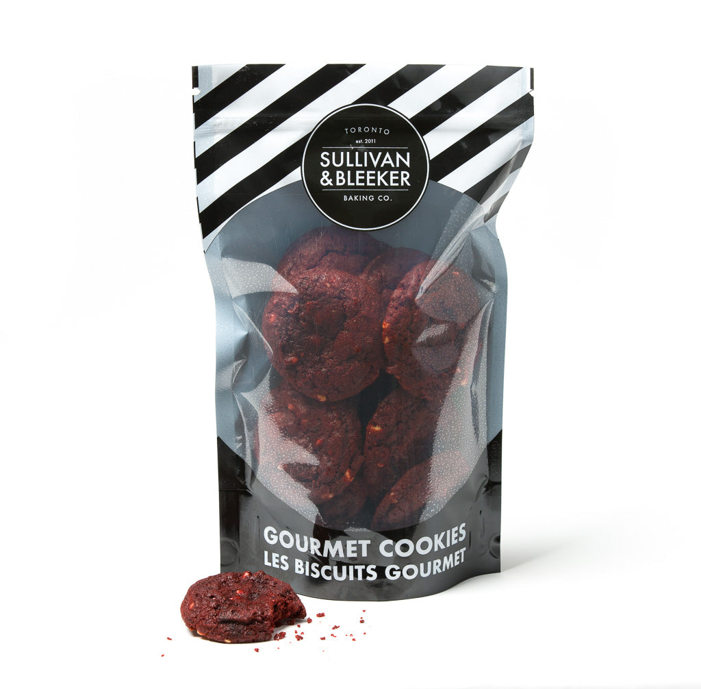 14 Mini soft-baked Red Velvet nut-free cookies in a resealable zip-top bag, perfect for catering and parties in Toronto.