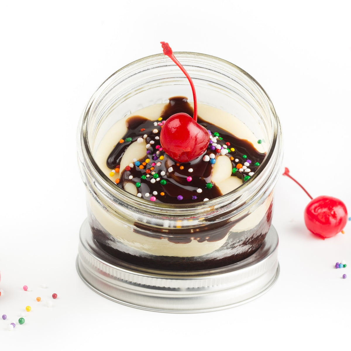 Sundae Jarcake (available in Mini/Regular sizes) in a jar with personalized sticker option, fudge filling, sprinkles, and a cherry for nut-free delivery in Toronto.