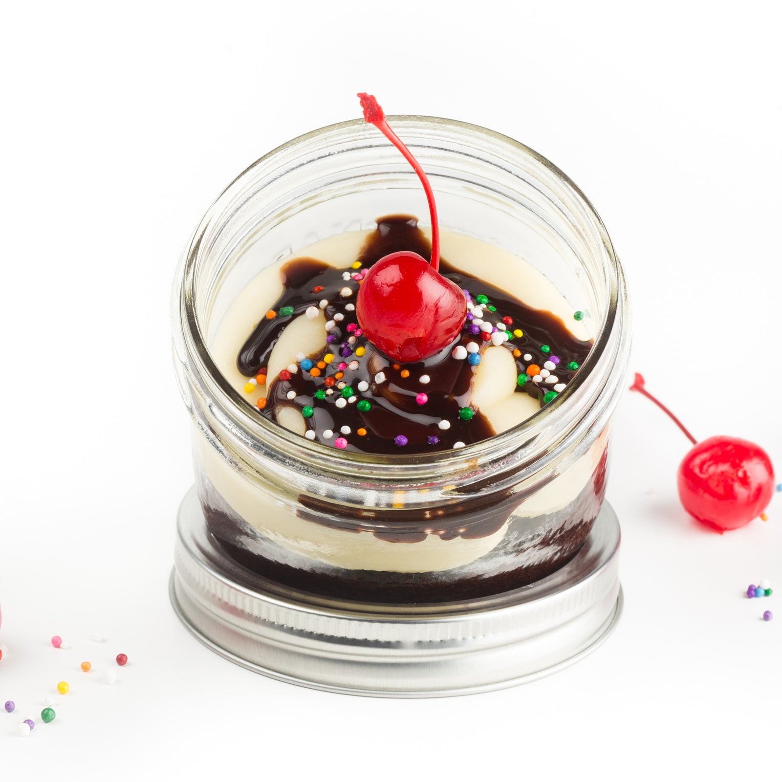 Sundae Jarcake (available in Mini/Regular sizes) in a jar with personalized sticker option, fudge filling, sprinkles, and a cherry for nut-free delivery in Toronto.